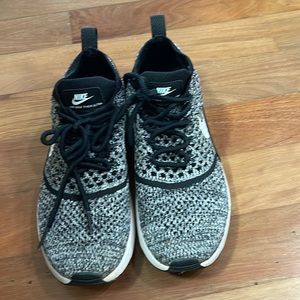 Nike air max thea ultra lightweight shoe with ties.
